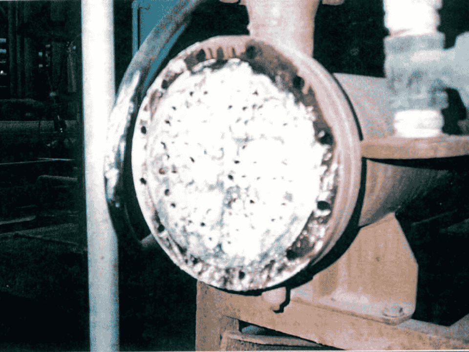 Shell-and-tube heat exchanger tube sheet blocked with limescale before HydroFLOW treatment