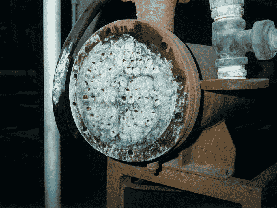 Heat exchanger before HydroFLOW — tube bundle blocked with hard limescale