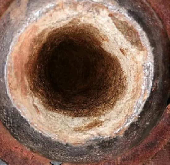 Hard calcite scale and biofouling in the cooling water circuit before HydroFLOW treatment — Zaporizhzhya Nuclear Power Plant, Ukraine