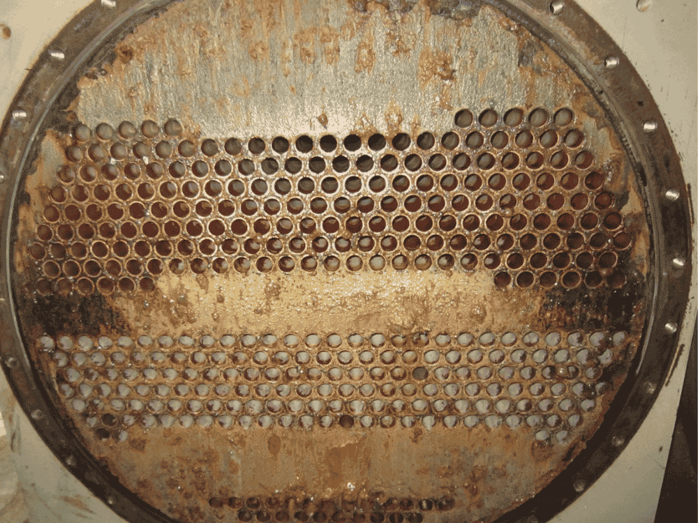 Link REIT cooling tower condenser before HydroFLOW — scale-fouled tubes