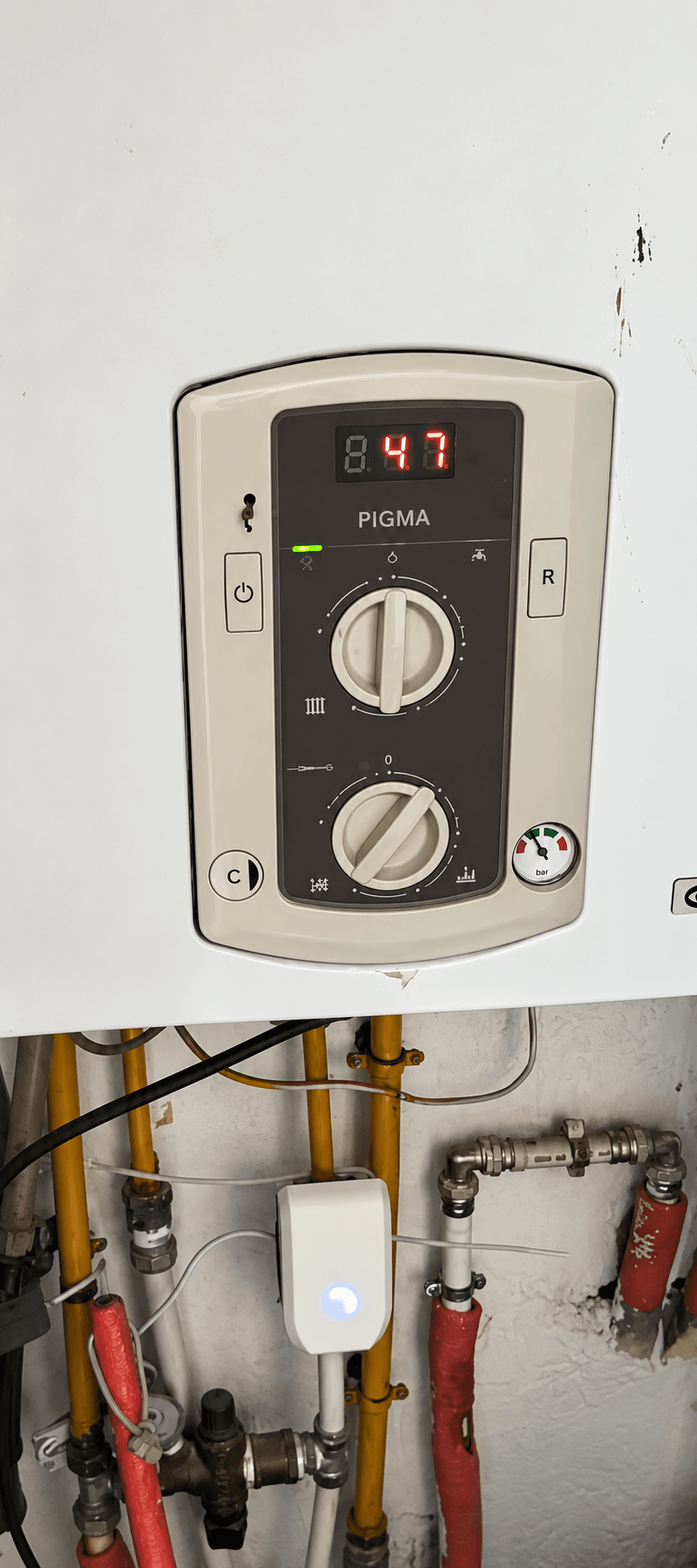 HydroFLOW Pearl fitted on the pipework beneath a wall-mounted combi boiler in a home in Tunisia