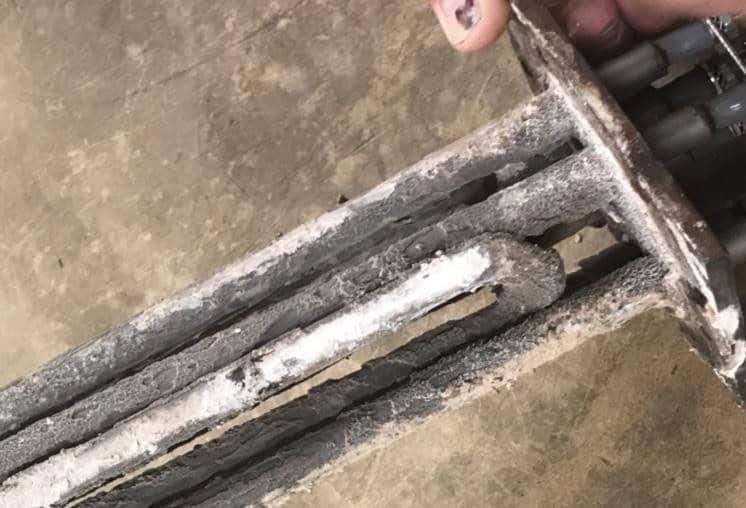 Electric steam boiler heating elements coated in hard grey scale before HydroFLOW treatment, Florida medical centre